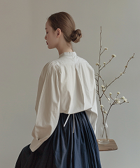 A model wearing a modern Tchai Kim silhouette