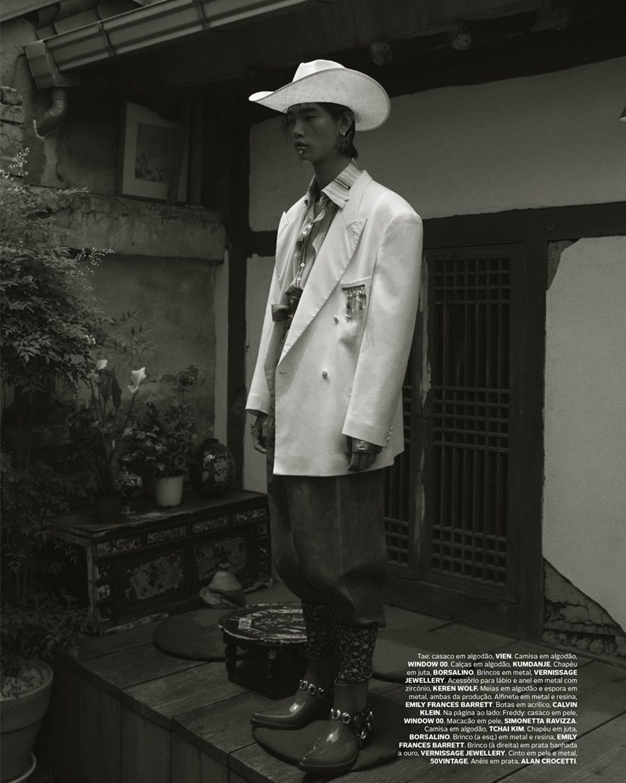 A Vogue Portugal editorial look in a white coat and wide brimmed hat