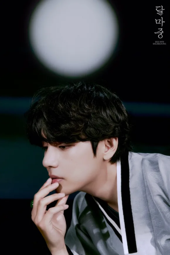 A man wearing a grey hanbok in a moonlit portrait