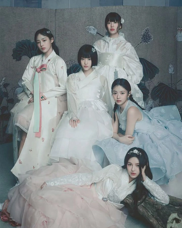 Five models in white hanbok-inspired gowns