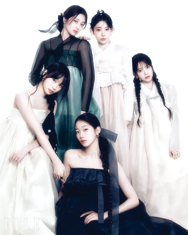 Five women wearing black and white contemporary hanbok