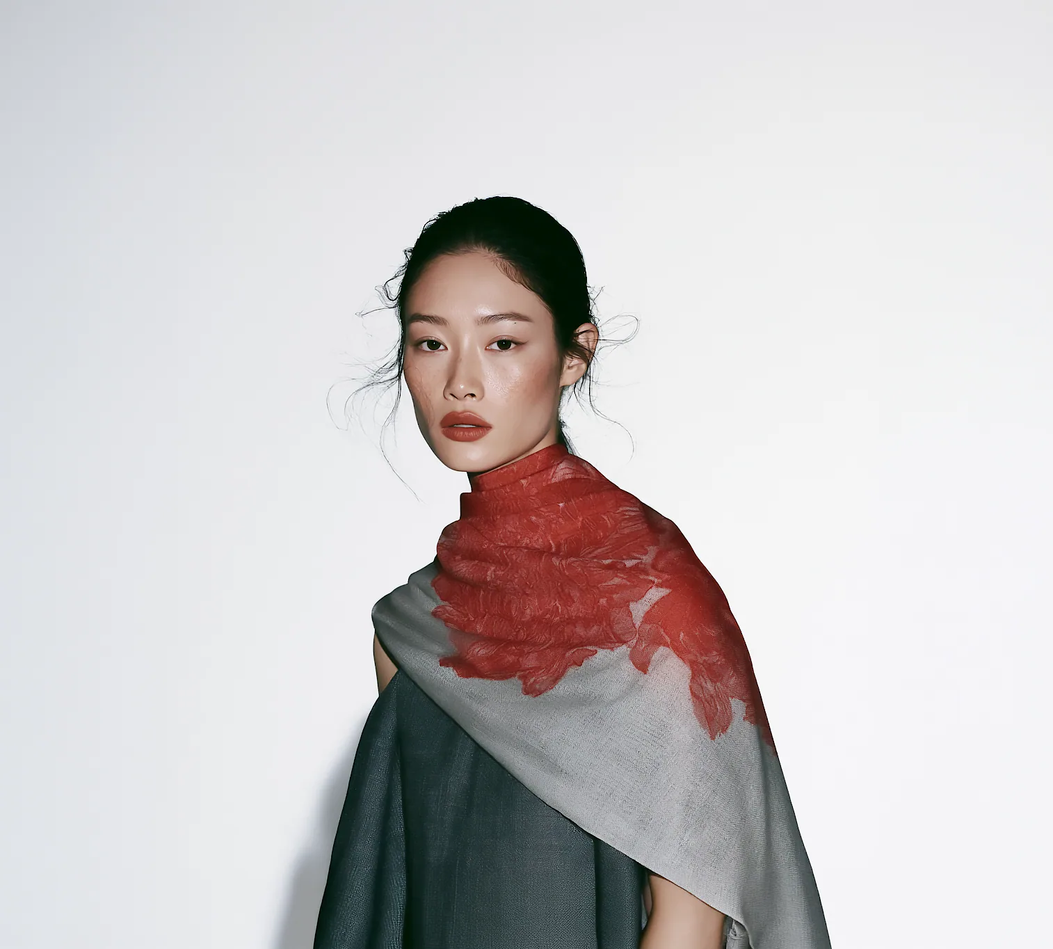 A model wearing the Seonhongcho Sheer Scarf, a sheer scarf with a bleeding scarlet floral print