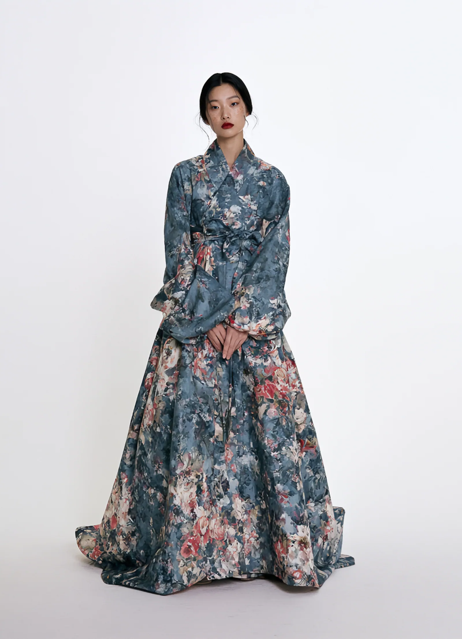 A model wearing the Palette Cheollik Dress in a watercolor floral print